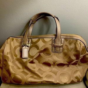 used coach bag 12"x8" no straps 2 pockets plus a zipper pocket